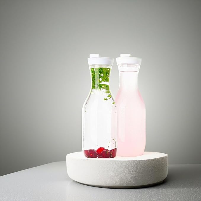 Clear Plastic Water Pitchers Carafes with Flip top White Lids 50 OZ Heavy Duty Beverage Pitcher Jug for Juice or iced Coffee Great for Mimosa bar Restuarants ot Schools Pack of 2