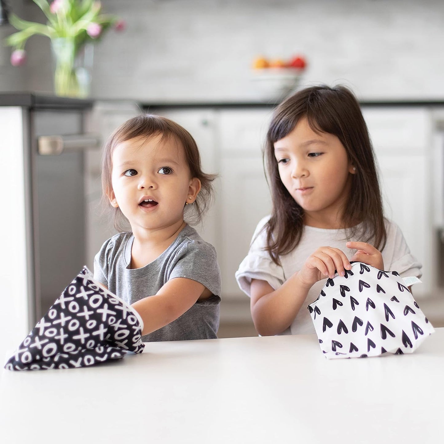 Bumkins - Cloth Snack & Sandwich Bags - For Storage, Travel, Food Prep, Lunch - Reusable, Water Resistant, Washable, Dishwasher Safe - Snack Bags for Kids - Zipper Closure - Black Hearts - 4 Pack