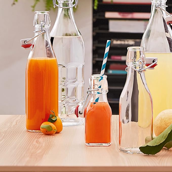 Bormioli Rocco Swing Top Glass Bottle (Set of 2) - 17 oz Reusable Container with Secure Metal Clasp, Ideal for Homemade Juices, Oil Infusions, Condiments, Mixers - Everyday Drinking Glasses